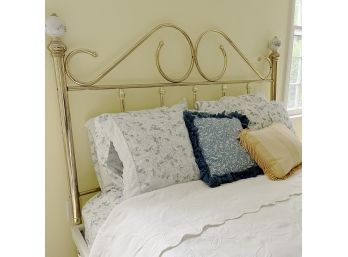 A Brass Headboard And Platform Bed With Underbed Storage