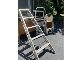 A Set Of 4 Ladders From 6' To Step Stool