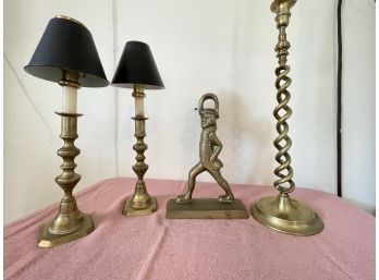 A Grouping Of Brass Items - Doorstop And Candelsticks