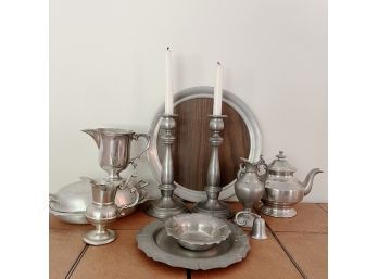An Assortment Of Pewter Including Candlesticks