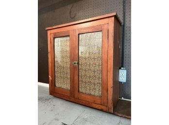 A Charming Antique Wall Cabinet With Glass Doors