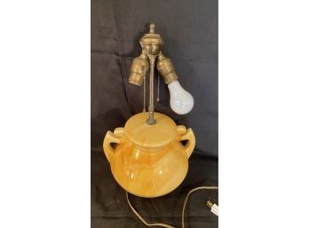 A Vintage Ceramic Table Lamp With Two Handles