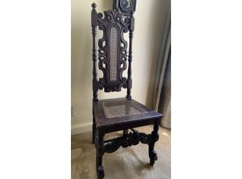 An Antique Carved Oak Caned Dining Chair.