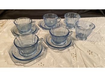 A Table Lot Of Blue Etched Tea Cups & Saucers