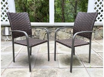 A Pair Of Resin Outdoor Arm Chairs