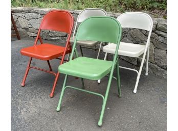 A Set Of 4 Painted Metal Folding Chairs