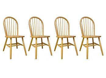 A Set Of 4 Oak Spindle Back Dining Chairs