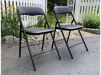 A Pair Of Vinyl Upholstered Folding Chairs