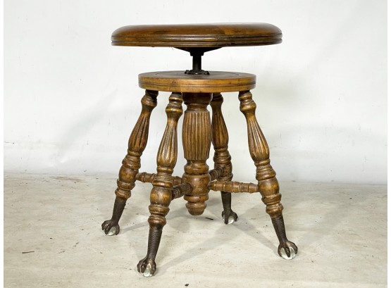 An Antique Walnut Adjustable Piano Stool With Glass Ball And Claw Feet -  Charles Parker Co.