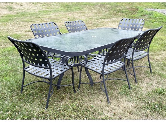 An Outdoor Dining Table And Chairs By Winston Furniture