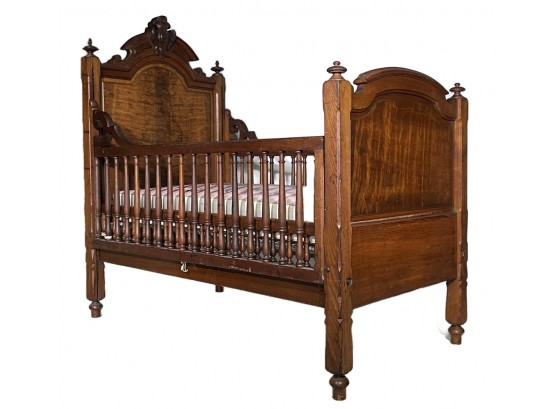 An Antique Victorian Carved Oak Crib