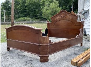 A Victorian Carved Mahogany Queen Bedstead