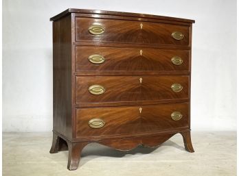 An Antique Crotch Mahogany Bow Front Chest Of Drawers