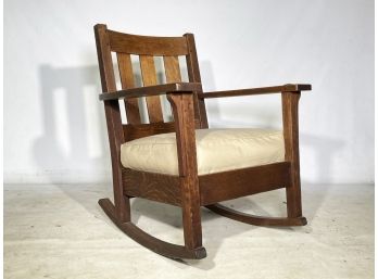 An Antique Stickley Mission Oak Rocking Chair