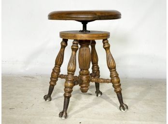An Antique Walnut Adjustable Piano Stool With Glass Ball And Claw Feet -  Charles Parker Co.