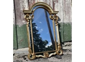 A Large Ornately Framed Mirror