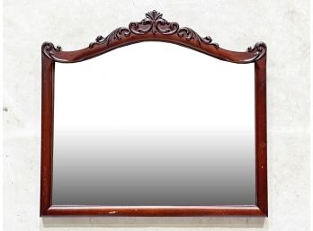 An Antique Scrolled Wood Mirror