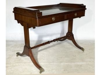 An Antique Mahogany Leather Top Student Desk