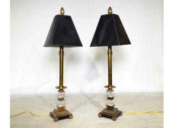 A Pair Of Stick Lamps With Leather Shades