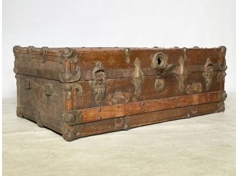 An Antique Wood Banded Travel Trunk