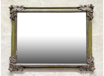 An Antique Mirror In Carved Wood Frame