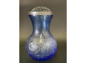 A Blue Vase With Wire Stem Placement Top