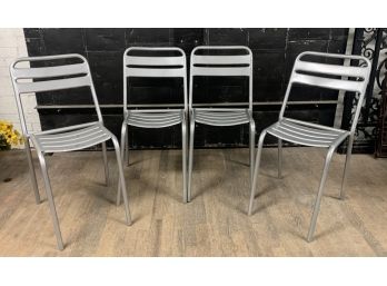 Set Of Four Stacking Tubular Side Chairs