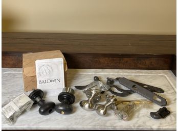 A Collection Of Door Knobs Including Baldwin