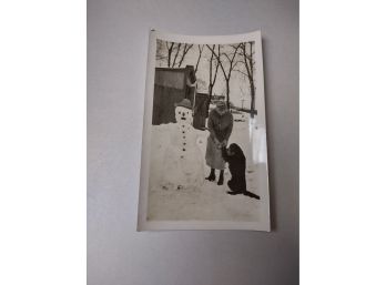 Snowman And A Dog