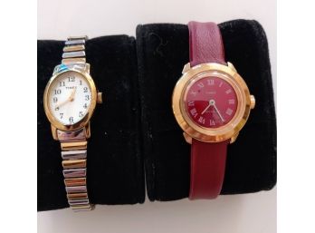 Pair Of Timex Watches, One Red Leather And The Other Stainless Steel