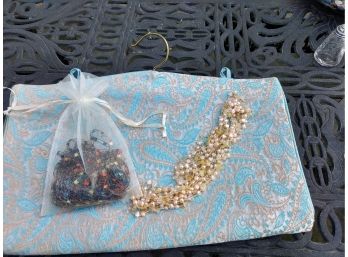 Travel Hanging Jewelry Case And Two Necklaces - One Made Of Silk Threads And The Other Freshwater Pearls
