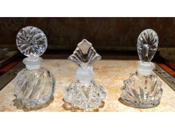 Three Vintage Perfume Bottles With Stoppers