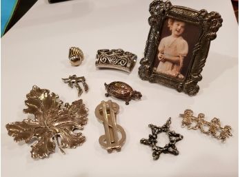 Group Of Nine Silver Plate Items, Picture Frame, Pins, Pendants And Money Clip