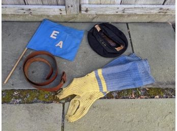 Grouping Of Random Items Including A Leather Belt, Flag, Navy Cap And Leg Warmers