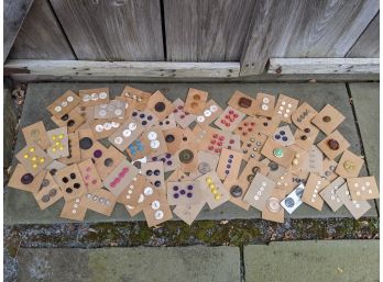 Collection Of Vintage And Antique Buttons Sewn Onto Boards
