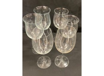 A Set Of Six  Different Size Crystal Wine Glasses