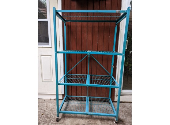 A Large Oragami Collapsible  Shelf In Bright Blue