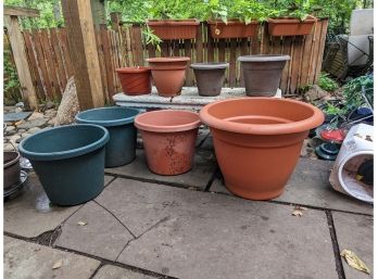 A Collection Of Plastic Pots Various Sizes
