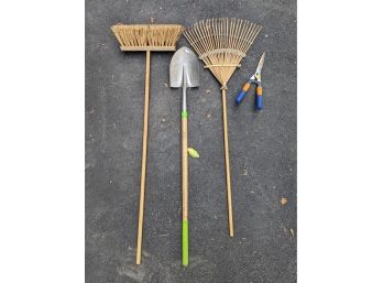 Gardening Tools And A Street Broom
