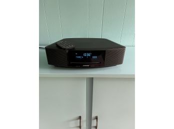 A Bose CD Player/Radio/Alarm Clock