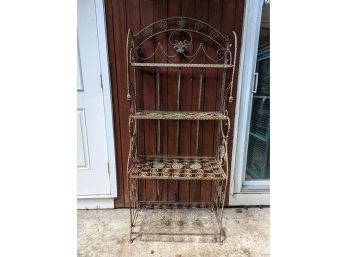 A Ornate Steel Rusted Bakers Rack With 4 Shelves For Display