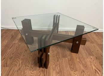 Glass Top Coffee Table With A Unique Wooden Base