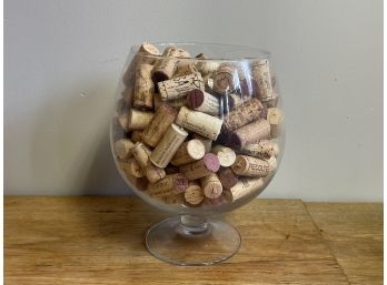 A Large Glass Filled With Corks