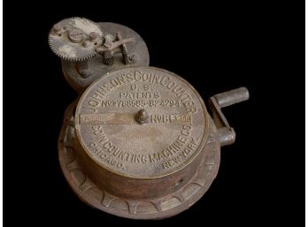 An Antique Hand-cranked Johnsons Coin Counter