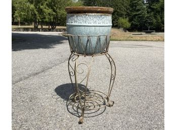 A Vintage Wrought Iron Plant Stand With Ceramic Planter