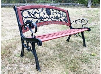 A Painted Oak And Cast Iron Garden Bench