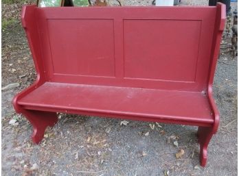 A Small Church Pew In Country Red Color