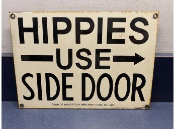 'Hippies Use Side Door' Metal Enamel Sign. Measures 7 1/8' X 10 1/8'.