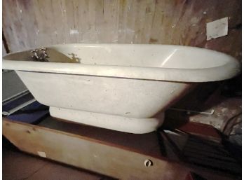 An Antique Cast Iron Skirted Bathtub