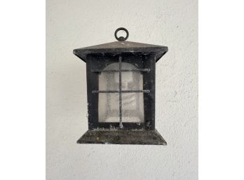 A Metal Lantern With Waterfall Lens